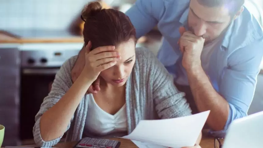Couple looking at the rising interest rate